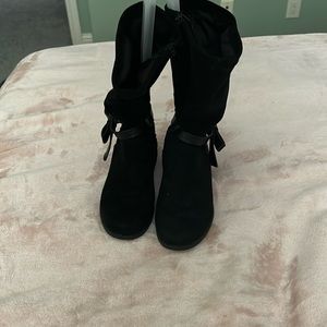 Black sparkly zip up boots with a bow